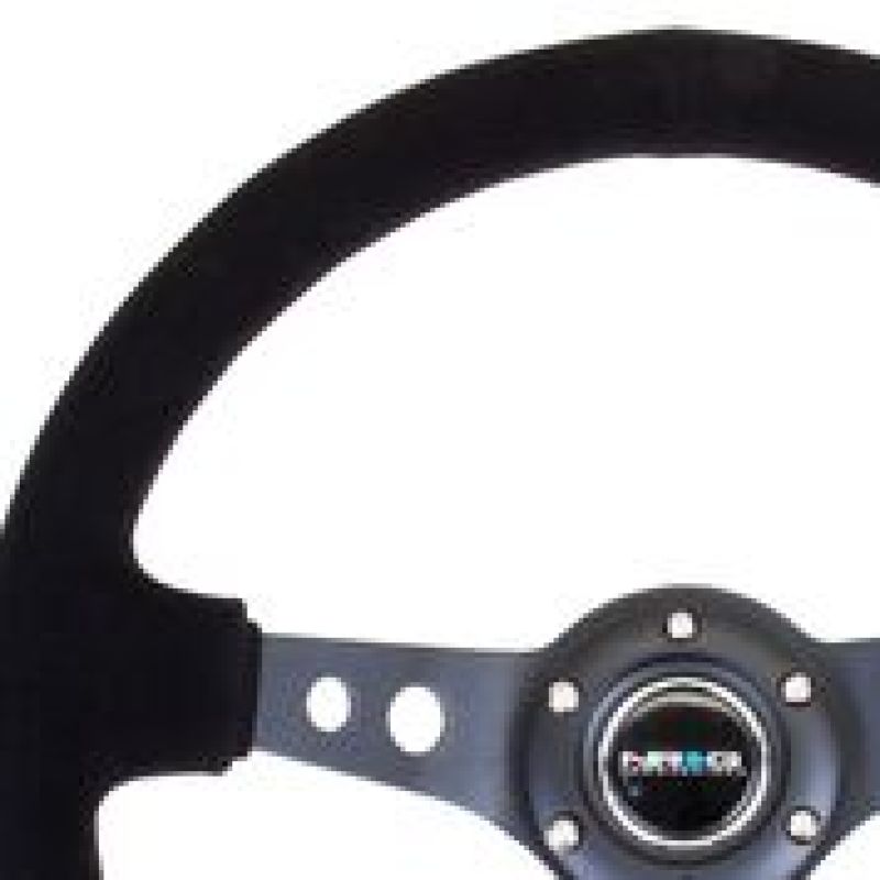 NRG Reinforced Steering Wheel (350mm / 3in. Deep) Blk Suede/Blk Stitch w/Black Circle Cutout Spokes NRG Reinforced Steering Wheel (350mm / 3in. Deep) Blk Suede/Blk Stitch w/Black Circle Cutout Spokes