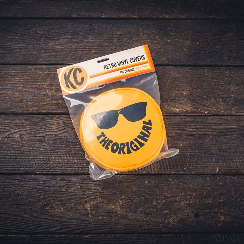 KC HiLiTES Retro 6in Round Yellow Vinyl Light Cover w/ Black KC Sunglasses Logo KC HiLiTES Retro 6in Round Yellow Vinyl Light Cover w/ Black KC Sunglasses Logo