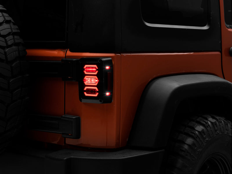 Raxiom 07-18 Jeep Wrangler JK LED Tail Lights- Black Housing (Smoked Lens) Raxiom 07-18 Jeep Wrangler JK LED Tail Lights- Black Housing (Smoked Lens)