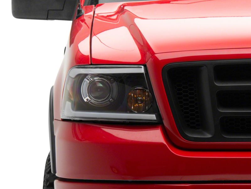 Raxiom 04-08 Ford F-150 Axial Series Projector Headlights w/ SEQL LED Bar- Blk Housing (Clear Lens) Raxiom 04-08 Ford F-150 Axial Series Projector Headlights w/ SEQL LED Bar- Blk Housing (Clear Lens)