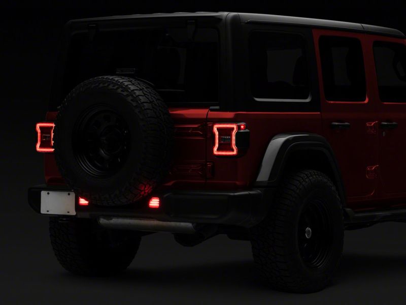 Raxiom 18-23 Jeep Wrangler JL Moab Rubicon Sahara Axial LED Rear Bumper Reflector Lights- Clear Raxiom 18-23 Jeep Wrangler JL Moab Rubicon Sahara Axial LED Rear Bumper Reflector Lights- Clear