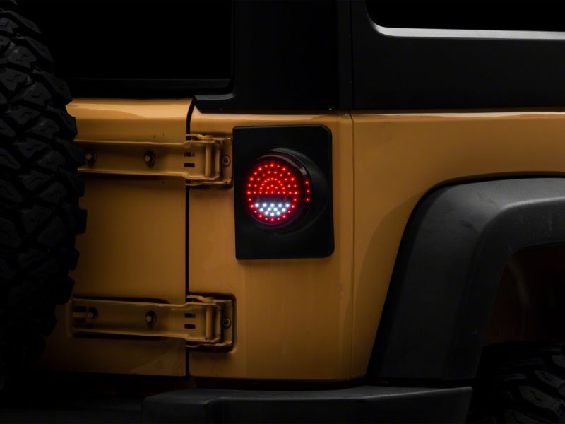 Raxiom 07-18 Jeep Wrangler JK Axial Series Halo LED Tail Lights- Blk Housing (Clear Lens) Raxiom 07-18 Jeep Wrangler JK Axial Series Halo LED Tail Lights- Blk Housing (Clear Lens)