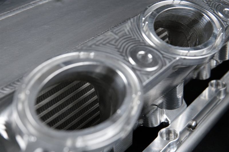 CSF Toyota A90/A91 Supra/ BMW G-Series B58 Charge-Air Cooler Manifold- Machined Billet Aluminum CSF Toyota A90/A91 Supra/ BMW G-Series B58 Charge-Air Cooler Manifold- Machined Billet Aluminum