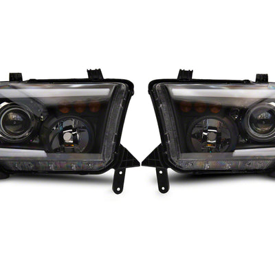 Raxiom 07-13 Toyota Tundra Axial Projector Headlights w/ SEQL LED Bar- Blk Housing (Clear Lens)