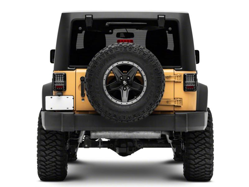 Raxiom 07-18 Jeep Wrangler JK Axial Series Lux LED Tail Lights- Blk Housing (Clear Lens) Raxiom 07-18 Jeep Wrangler JK Axial Series Lux LED Tail Lights- Blk Housing (Clear Lens)