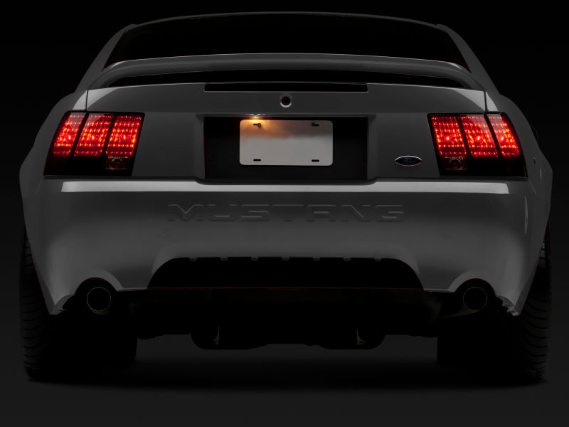 Raxiom 99-04 Ford Mustang Excluding 99-01 Cobra Tail Lights- Black Housing (Smoked Lens) Raxiom 99-04 Ford Mustang Excluding 99-01 Cobra Tail Lights- Black Housing (Smoked Lens)