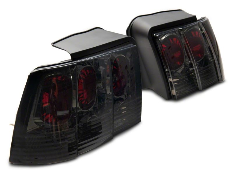 Raxiom 99-04 Ford Mustang Axial Series Altezza Style Tail Lights- Blk Housing (Smoked Lens) Raxiom 99-04 Ford Mustang Axial Series Altezza Style Tail Lights- Blk Housing (Smoked Lens)