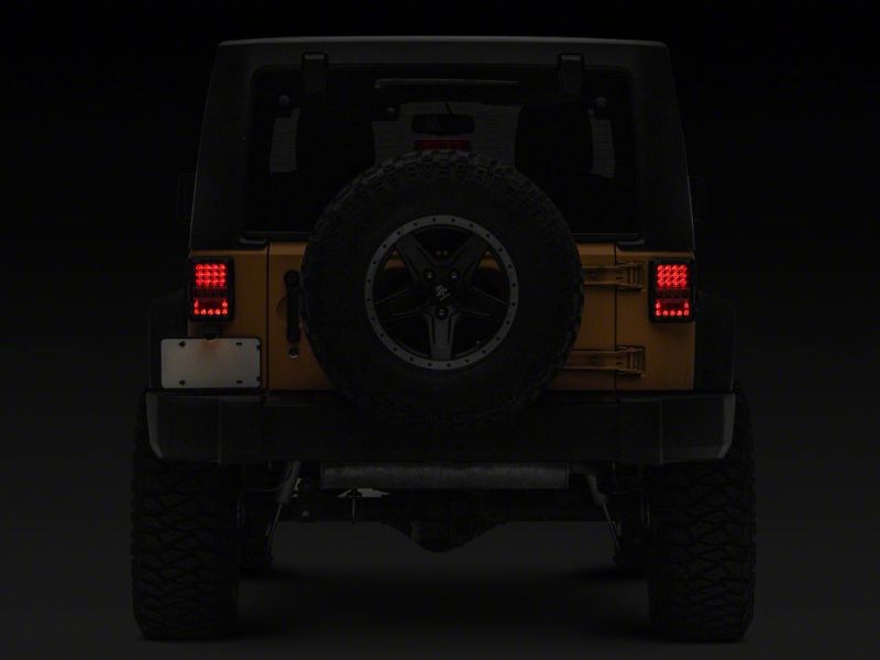 Raxiom 07-18 Jeep Wrangler JK Axial Series Lux LED Tail Lights- Blk Housing (Clear Lens) Raxiom 07-18 Jeep Wrangler JK Axial Series Lux LED Tail Lights- Blk Housing (Clear Lens)