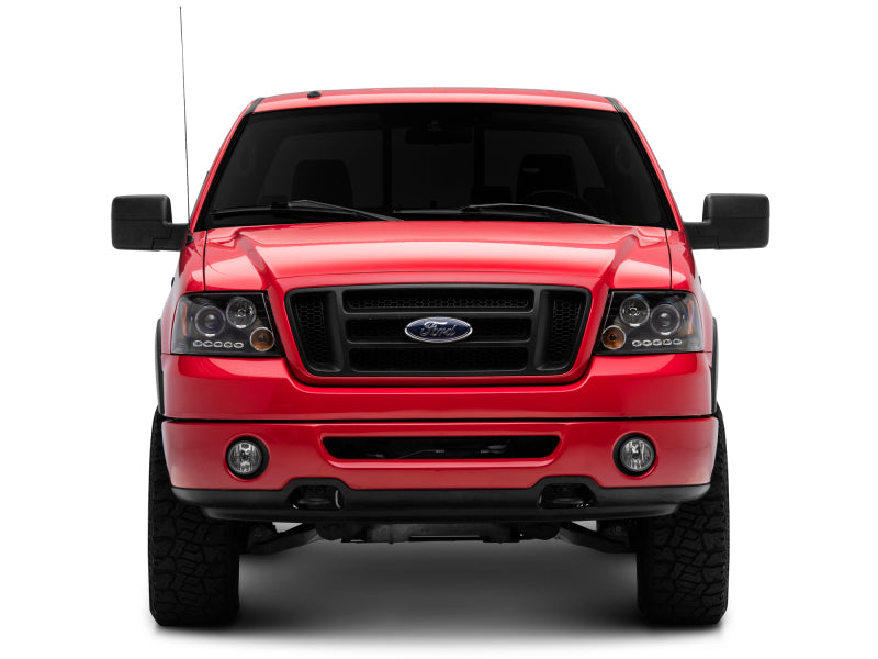 Raxiom 04-08 Ford F-150 Dual LED Halo Projector Headlights- Black Housing (Clear Lens) Raxiom 04-08 Ford F-150 Dual LED Halo Projector Headlights- Black Housing (Clear Lens)