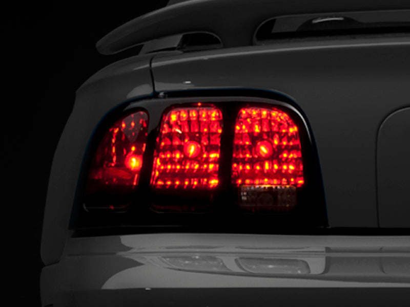 Raxiom 96-98 Ford Mustang Tail Lights- Black Housing (Smoked Lens) Raxiom 96-98 Ford Mustang Tail Lights- Black Housing (Smoked Lens)