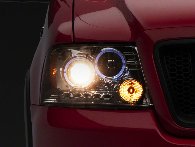 Raxiom 04-08 Ford F-150 Dual LED Halo Projector Headlights- Chrome Housing (Clear Lens) Raxiom 04-08 Ford F-150 Dual LED Halo Projector Headlights- Chrome Housing (Clear Lens)