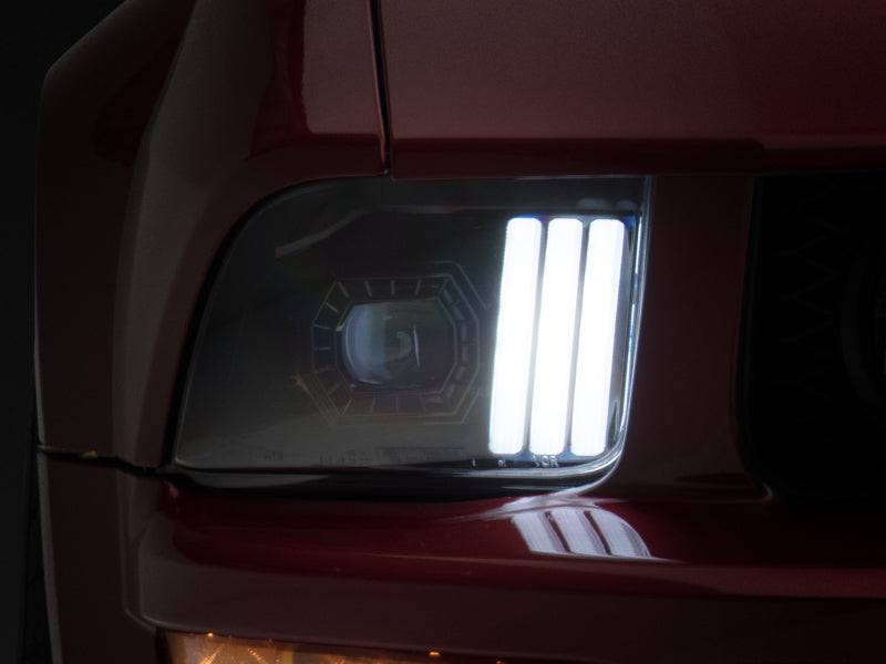 Raxiom 05-09 Ford Mustang w/ Halogen Prjctor Headlights- Black Housing (Clear Lens) (No GT500 ) Raxiom 05-09 Ford Mustang w/ Halogen Prjctor Headlights- Black Housing (Clear Lens) (No GT500 )