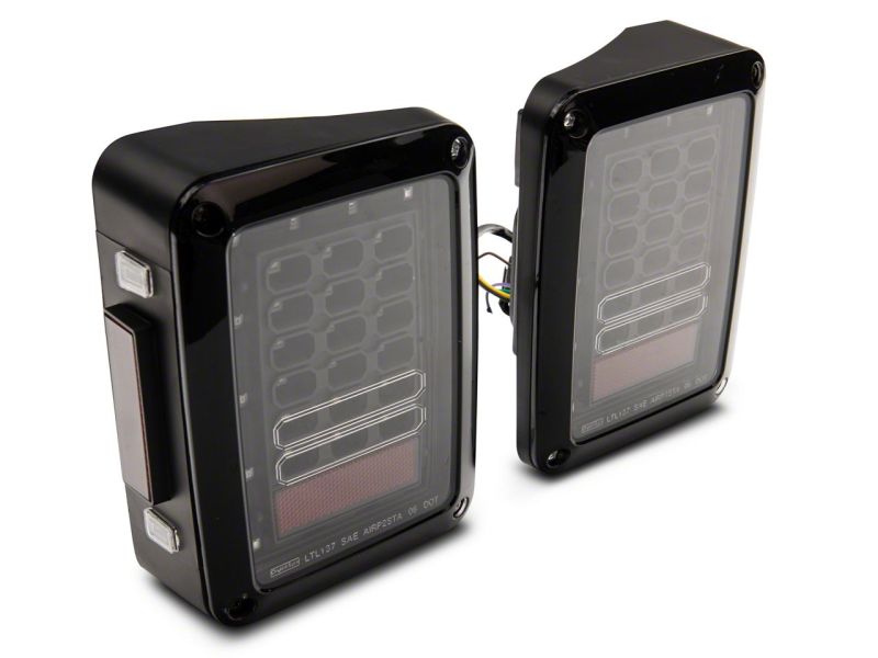 Raxiom 07-18 Jeep Wrangler JK Axial Series LED Tail Lights- Blk Housing (Clear Lens) Raxiom 07-18 Jeep Wrangler JK Axial Series LED Tail Lights- Blk Housing (Clear Lens)