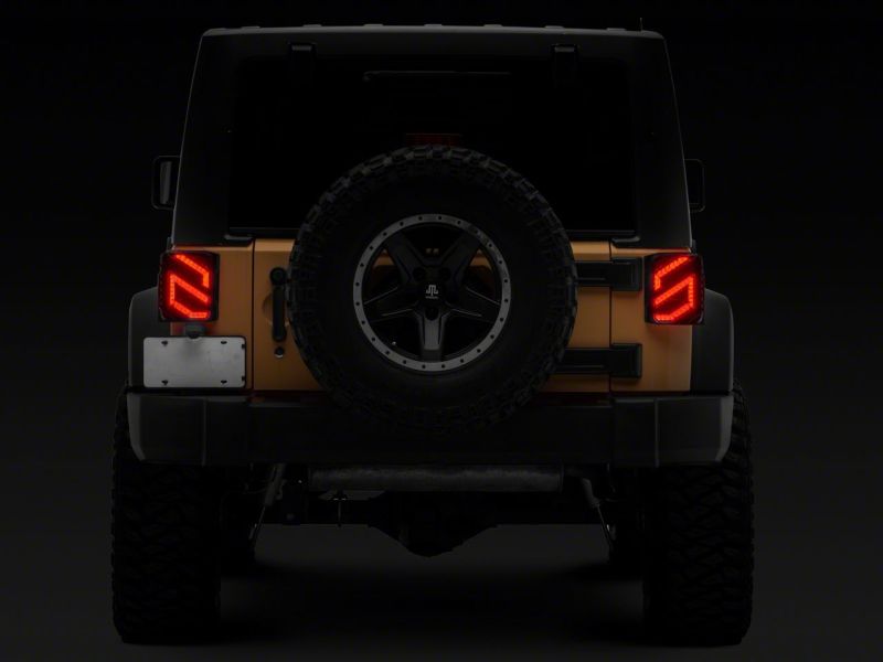 Raxiom 07-18 Jeep Wrangler JK Axial Series Trident LED Tail Lights- Blk Housing (Clear Lens) Raxiom 07-18 Jeep Wrangler JK Axial Series Trident LED Tail Lights- Blk Housing (Clear Lens)