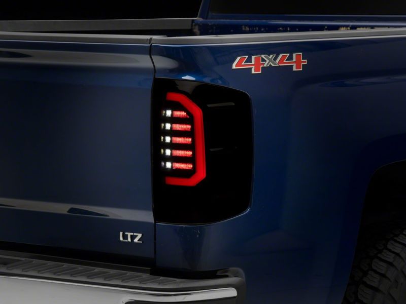Raxiom 14-18 Chevrolet Silverado 1500 Axial Series LED Tail Lights- Blk Housing (Smoked Lens) Raxiom 14-18 Chevrolet Silverado 1500 Axial Series LED Tail Lights- Blk Housing (Smoked Lens)
