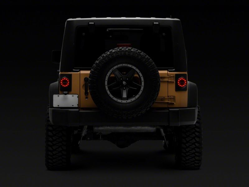 Raxiom 07-18 Jeep Wrangler JK Axial Series Halo LED Tail Lights- Blk Housing (Clear Lens) Raxiom 07-18 Jeep Wrangler JK Axial Series Halo LED Tail Lights- Blk Housing (Clear Lens)