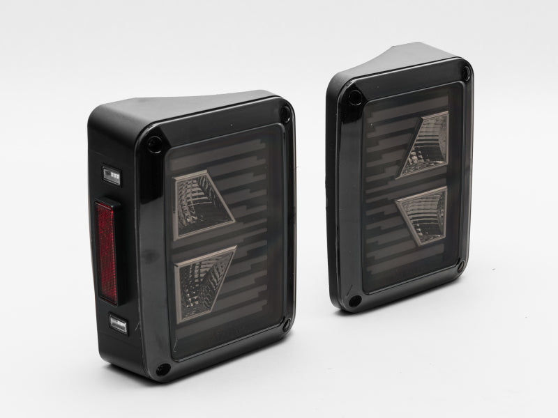 Raxiom 07-18 Jeep Wrangler JK Axial Series Vision LED Tail Lights- Black Housing (Smoked Lens) Raxiom 07-18 Jeep Wrangler JK Axial Series Vision LED Tail Lights- Black Housing (Smoked Lens)