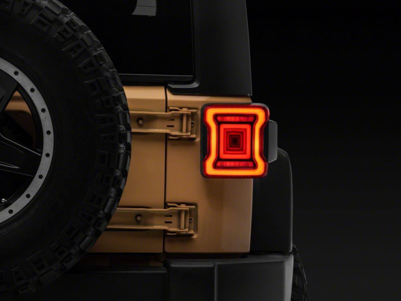 Raxiom 07-18 Jeep Wrangler JK Axial Series JL Style LED Tail Lights- BlkHousing- Red Lens Raxiom 07-18 Jeep Wrangler JK Axial Series JL Style LED Tail Lights- BlkHousing- Red Lens