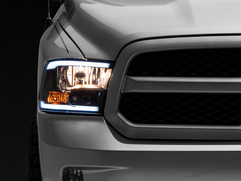 Raxiom 09-18 Dodge RAM 1500/2500/3500 Axial Series Headlights w/ LED Bar- Blk Housing (Clear Lens) Raxiom 09-18 Dodge RAM 1500/2500/3500 Axial Series Headlights w/ LED Bar- Blk Housing (Clear Lens)