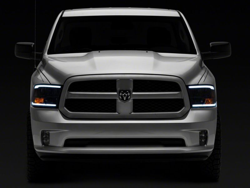 Raxiom 09-18 Dodge RAM 1500/2500/3500 Axial Series Headlights w/ LED Bar- Blk Housing (Clear Lens) Raxiom 09-18 Dodge RAM 1500/2500/3500 Axial Series Headlights w/ LED Bar- Blk Housing (Clear Lens)
