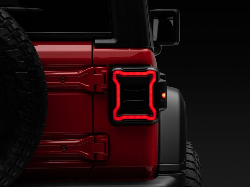 Raxiom 18-22 Jeep Wrangler JL LED Tail Lights- Black Housing (Smoked Lens) Raxiom 18-22 Jeep Wrangler JL LED Tail Lights- Black Housing (Smoked Lens)
