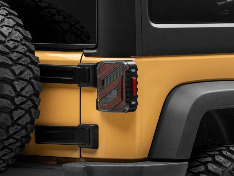 Raxiom 07-18 Jeep Wrangler JK Axial Series Trident LED Tail Lights- Blk Housing (Clear Lens) Raxiom 07-18 Jeep Wrangler JK Axial Series Trident LED Tail Lights- Blk Housing (Clear Lens)