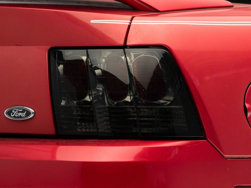 Raxiom 99-04 Ford Mustang Axial Series Altezza Style Tail Lights- Blk Housing (Smoked Lens) Raxiom 99-04 Ford Mustang Axial Series Altezza Style Tail Lights- Blk Housing (Smoked Lens)