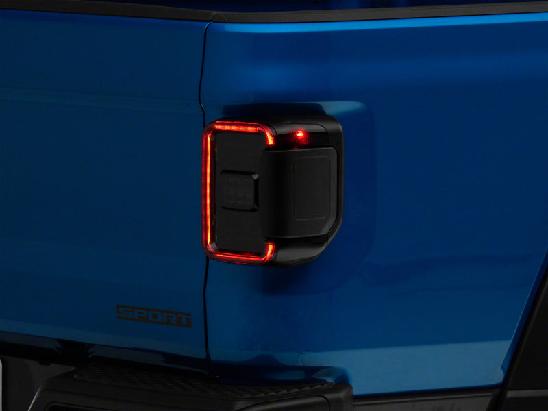 Raxiom 20-23 Jeep Gladiator JT w/ Factory Halogen LED Tail Lights- Blk Housing (Smoked Lens) Raxiom 20-23 Jeep Gladiator JT w/ Factory Halogen LED Tail Lights- Blk Housing (Smoked Lens)