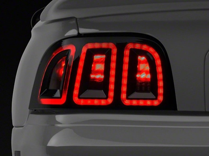 Raxiom 96-98 Ford Mustang Icon LED Tail Lights- Black Housing (Smoked Lens) Raxiom 96-98 Ford Mustang Icon LED Tail Lights- Black Housing (Smoked Lens)
