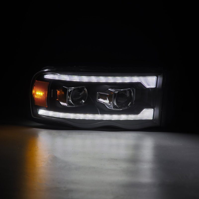 AlphaRex 02-05 Dodge Ram 1500 PRO-Series Projector Headlights Plank Style Black w/Seq Signal AlphaRex 02-05 Dodge Ram 1500 PRO-Series Projector Headlights Plank Style Black w/Seq Signal