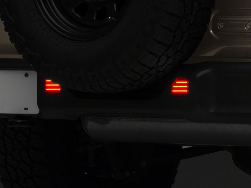 Raxiom 18-23 Jeep Wrangler JL Moab Rubicon Sahara Axial LED Rear Bumper Reflector Lights- Smoked Raxiom 18-23 Jeep Wrangler JL Moab Rubicon Sahara Axial LED Rear Bumper Reflector Lights- Smoked