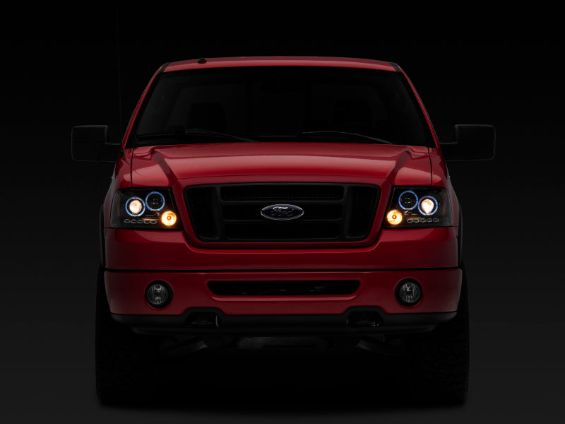 Raxiom 04-08 Ford F-150 Dual LED Halo Projector Headlights- Black Housing (Clear Lens) Raxiom 04-08 Ford F-150 Dual LED Halo Projector Headlights- Black Housing (Clear Lens)