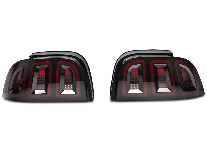 Raxiom 96-98 Ford Mustang Icon LED Tail Lights- Black Housing (Smoked Lens) Raxiom 96-98 Ford Mustang Icon LED Tail Lights- Black Housing (Smoked Lens)