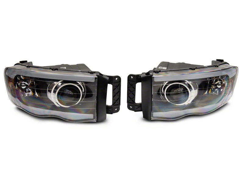 Raxiom 02-05 Dodge RAM 1500/2500/3500 Axial LED Projector Headlights- Blk Housing (Clear Lens) Raxiom 02-05 Dodge RAM 1500/2500/3500 Axial LED Projector Headlights- Blk Housing (Clear Lens)
