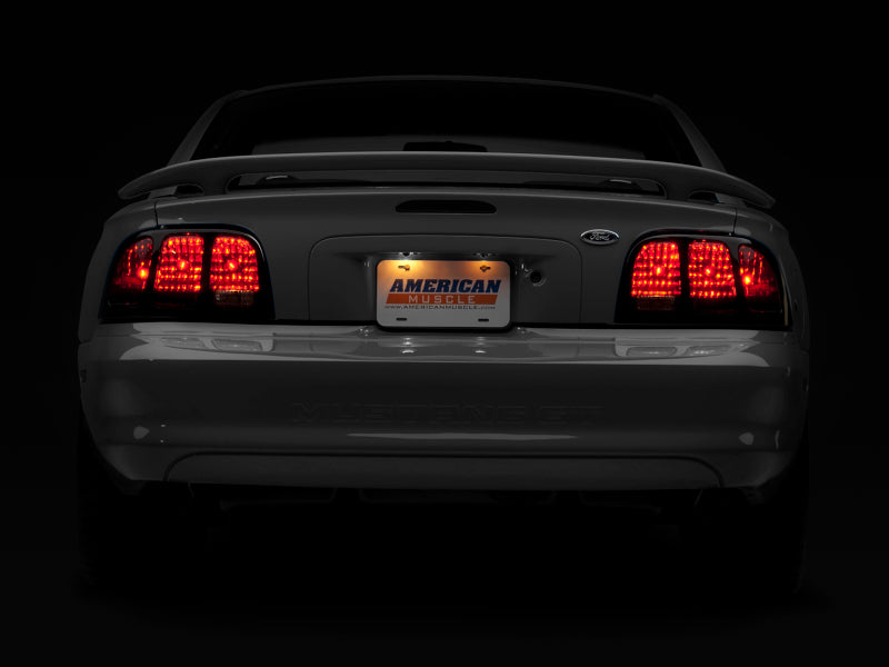 Raxiom 96-98 Ford Mustang Tail Lights- Black Housing (Smoked Lens) Raxiom 96-98 Ford Mustang Tail Lights- Black Housing (Smoked Lens)