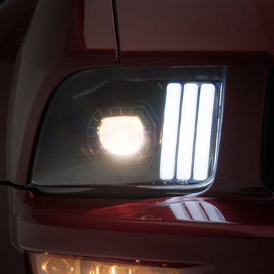Raxiom 05-09 Ford Mustang w/ Halogen Prjctor Headlights- Black Housing (Clear Lens) (No GT500 )