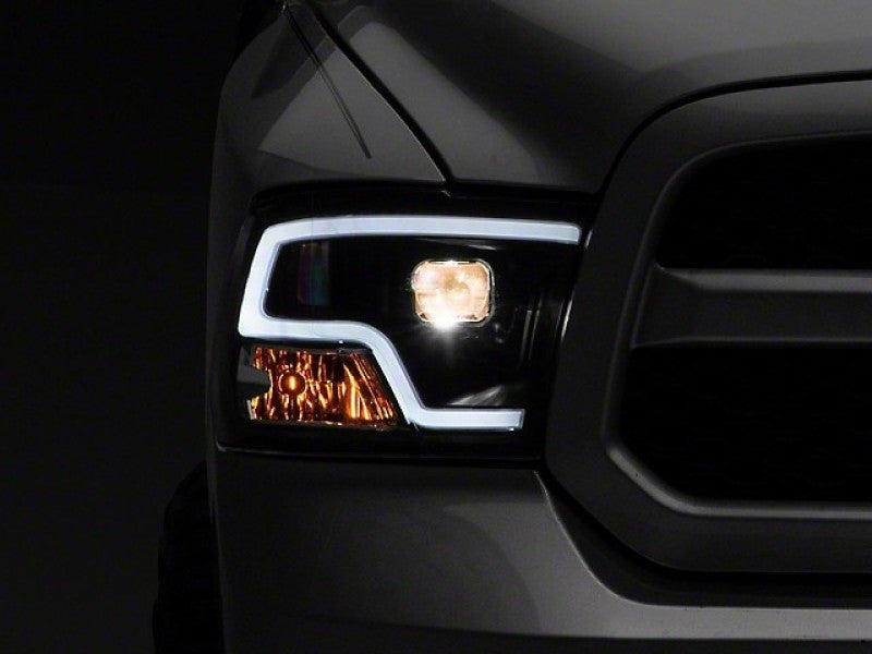 Raxiom 09-18 RAM 1500 LED Halo Projector Headlights- Black Housing (Clear Lens) Raxiom 09-18 RAM 1500 LED Halo Projector Headlights- Black Housing (Clear Lens)