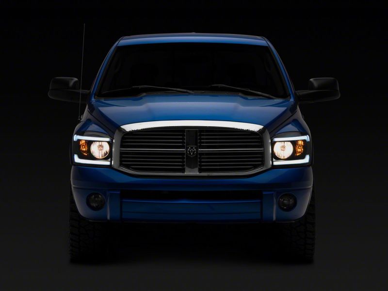 Raxiom 06-09 Dodge RAM 1500/2500/3500 Axial Headlights w/ SEQL LED Bar- Blk Housing (Clear Lens) Raxiom 06-09 Dodge RAM 1500/2500/3500 Axial Headlights w/ SEQL LED Bar- Blk Housing (Clear Lens)