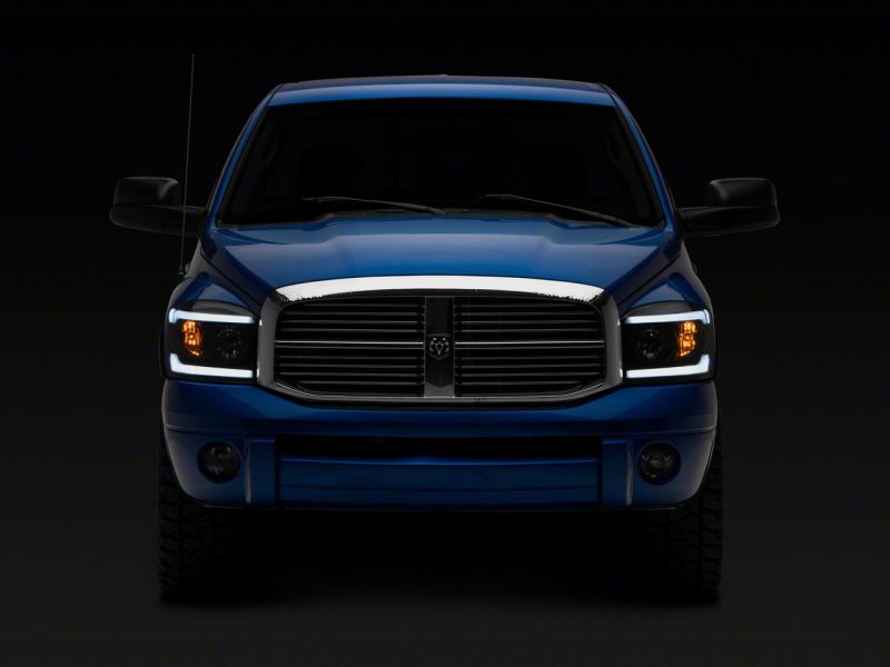Raxiom 06-09 Dodge RAM 1500/2500/3500 Axial Headlights w/ SEQL LED Bar- Blk Housing (Clear Lens) Raxiom 06-09 Dodge RAM 1500/2500/3500 Axial Headlights w/ SEQL LED Bar- Blk Housing (Clear Lens)