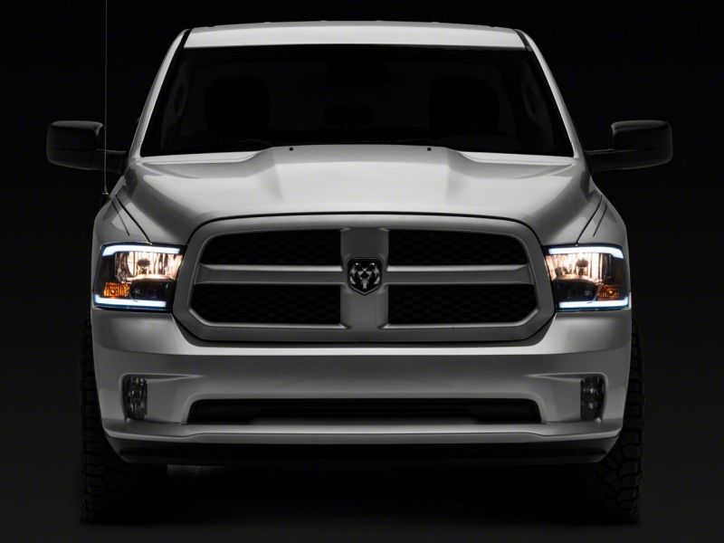 Raxiom 09-18 Dodge RAM 1500/2500/3500 Axial Series Headlights w/ LED Bar- Blk Housing (Clear Lens) Raxiom 09-18 Dodge RAM 1500/2500/3500 Axial Series Headlights w/ LED Bar- Blk Housing (Clear Lens)