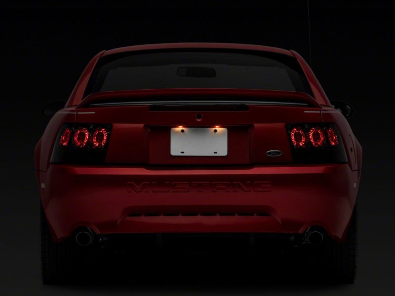 Raxiom 99-04 Ford Mustang Axial Series Altezza Style Tail Lights- Blk Housing (Smoked Lens) Raxiom 99-04 Ford Mustang Axial Series Altezza Style Tail Lights- Blk Housing (Smoked Lens)