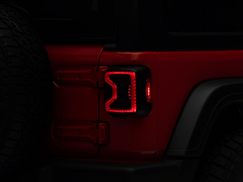 Raxiom 18-23 Jeep Wrangler JL LED Tail Lights- Blk Housing (Smoked Lens) Raxiom 18-23 Jeep Wrangler JL LED Tail Lights- Blk Housing (Smoked Lens)