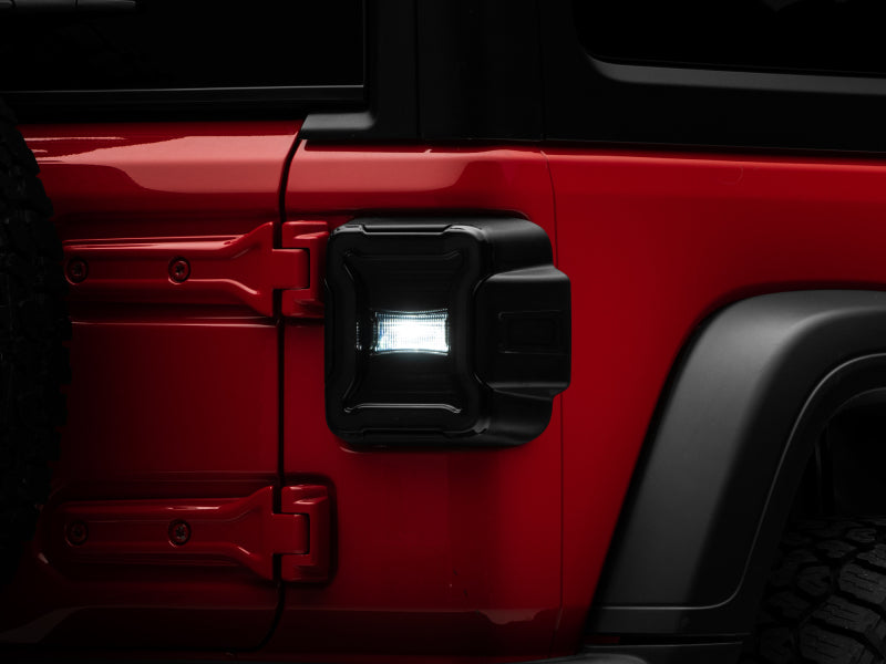 Raxiom 18-22 Jeep Wrangler JL LED Tail Lights- Black Housing (Smoked Lens) Raxiom 18-22 Jeep Wrangler JL LED Tail Lights- Black Housing (Smoked Lens)