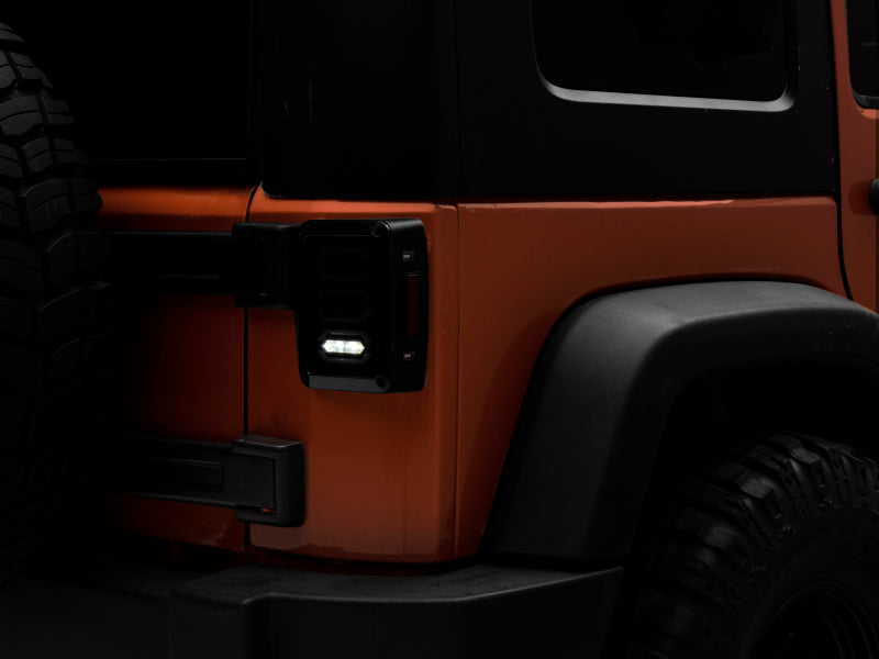 Raxiom 07-18 Jeep Wrangler JK LED Tail Lights- Black Housing (Smoked Lens) Raxiom 07-18 Jeep Wrangler JK LED Tail Lights- Black Housing (Smoked Lens)