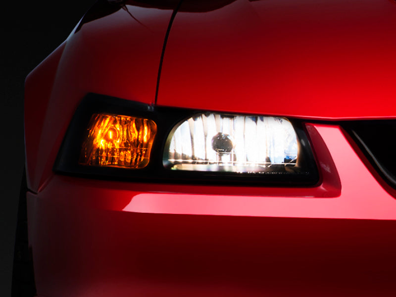 Raxiom 99-04 Ford Mustang Axial Series OE Style Headlights- Black Housing (Smoked Lens) Raxiom 99-04 Ford Mustang Axial Series OE Style Headlights- Black Housing (Smoked Lens)