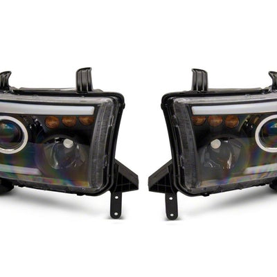 Raxiom 07-13 Toyota Tundra Axial Series Projector Headlights w/ LED Bar- Blk Housing (Clear Lens)