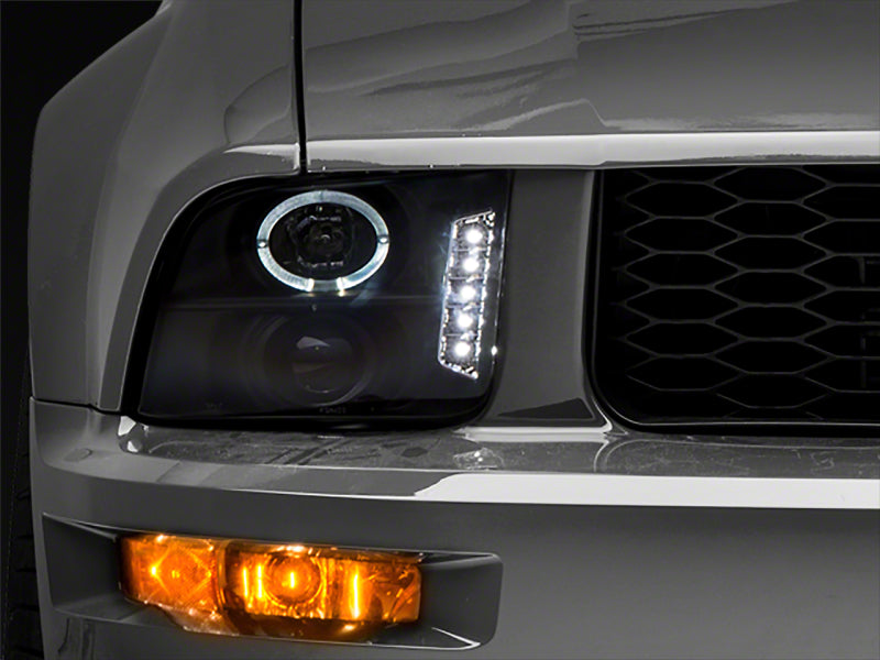 Raxiom 05-09 Ford Mustang Excluding GT500 LED Halo Projector Headlights- Blk Housing (Clear Lens) Raxiom 05-09 Ford Mustang Excluding GT500 LED Halo Projector Headlights- Blk Housing (Clear Lens)