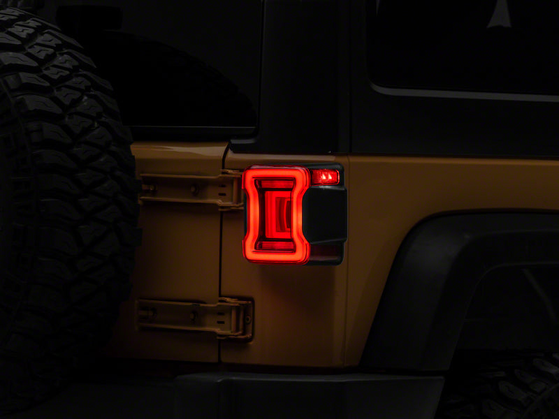 Raxiom 07-18 Jeep Wrangler JK Axial Series JL Style LED Tail Lights- BlkHousing- Red Lens Raxiom 07-18 Jeep Wrangler JK Axial Series JL Style LED Tail Lights- BlkHousing- Red Lens