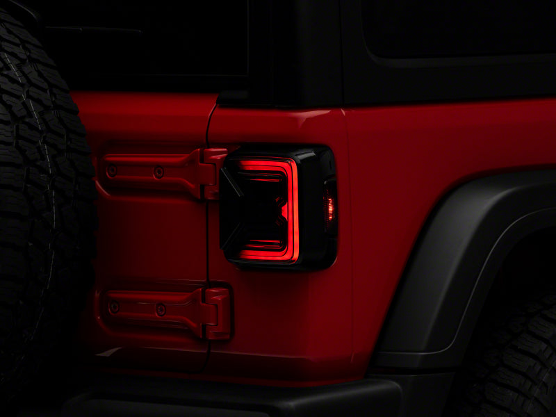 Raxiom 18-23 Jeep Wrangler JL Axial Series LED Tail Lights- Blk Housing (Smoked Lens) Raxiom 18-23 Jeep Wrangler JL Axial Series LED Tail Lights- Blk Housing (Smoked Lens)