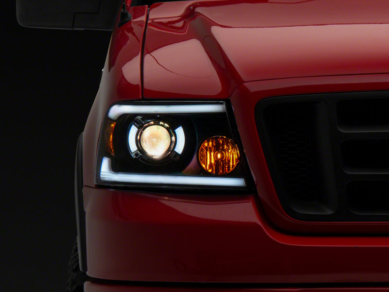 Raxiom 04-08 Ford F-150 Axial Series Projector Headlights w/ SEQL LED Bar- Blk Housing (Clear Lens) Raxiom 04-08 Ford F-150 Axial Series Projector Headlights w/ SEQL LED Bar- Blk Housing (Clear Lens)